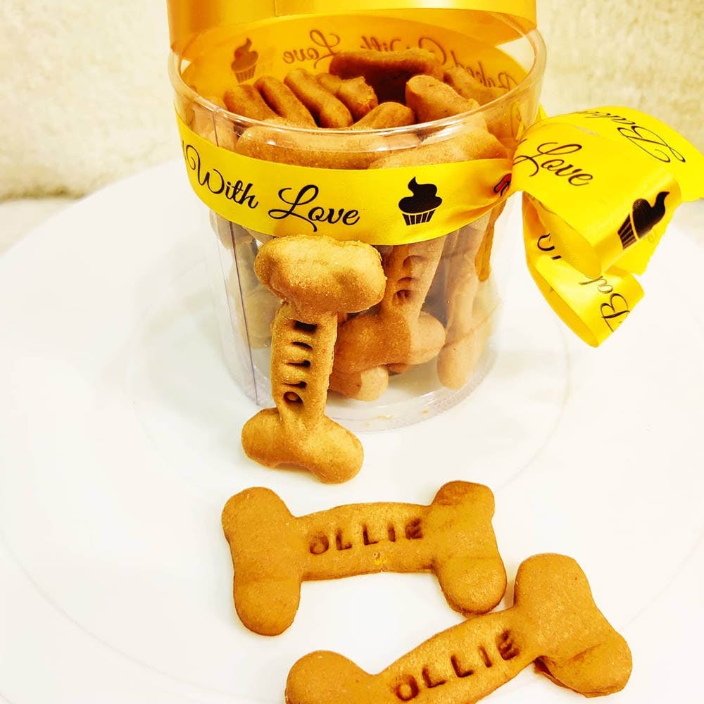Yellow,Font,Animal cracker,Snack,Food,Dog toy,Dog supply,Cuisine