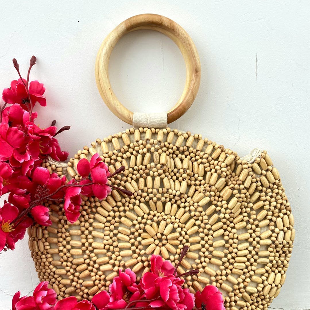 Bag,Fashion accessory,Handbag,Chain,Plant,Artificial flower,Petal,Flower