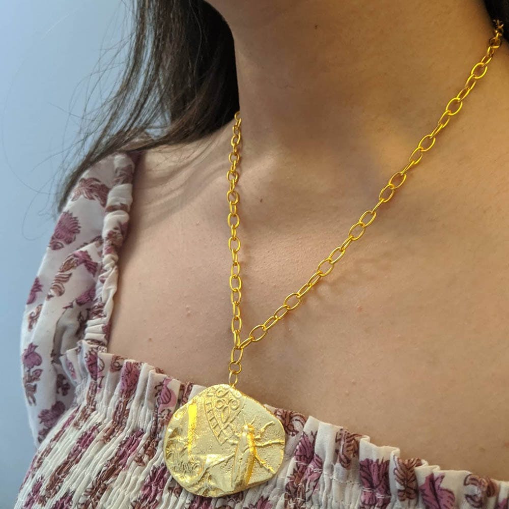 Necklace,Jewellery,Yellow,Body jewelry,Fashion accessory,Chain,Pendant,Neck,Locket,Metal