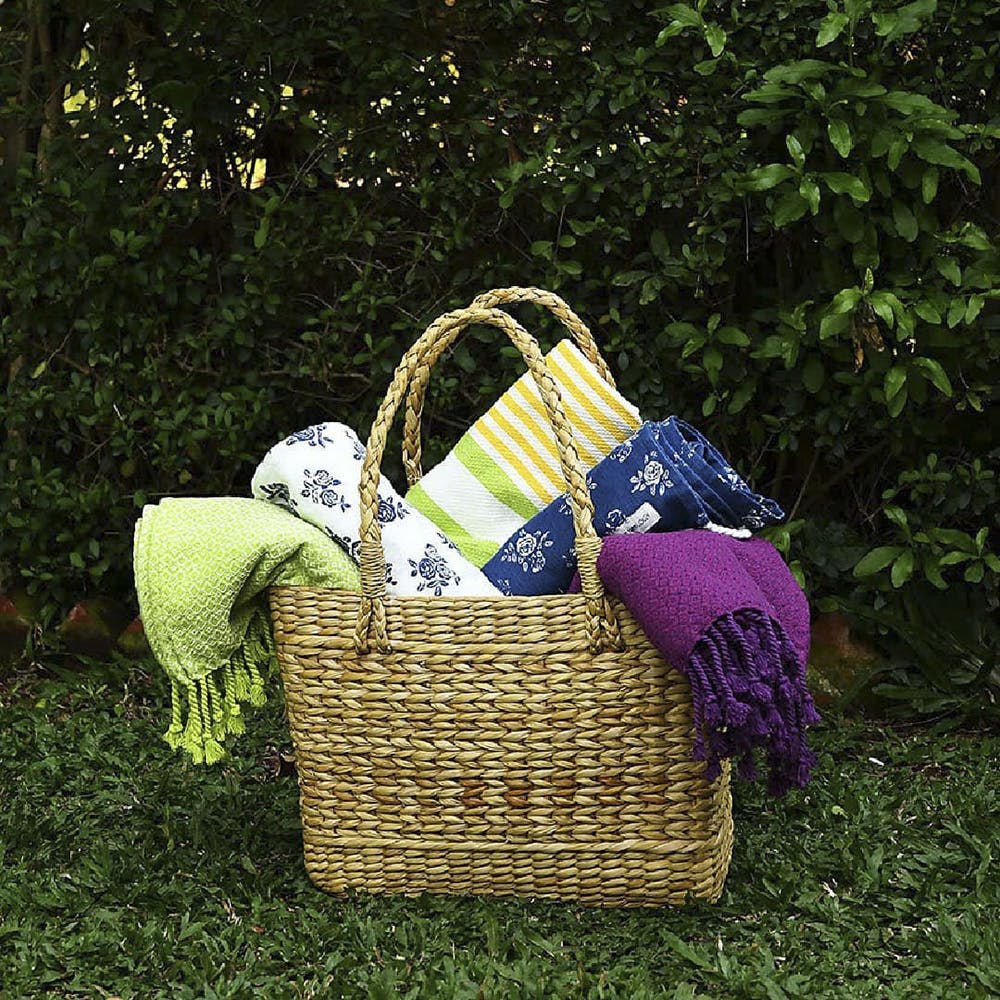 Bag,Basket,Picnic basket,Handbag,Grass,Wicker,Storage basket,Fashion accessory,Plant,Home accessories
