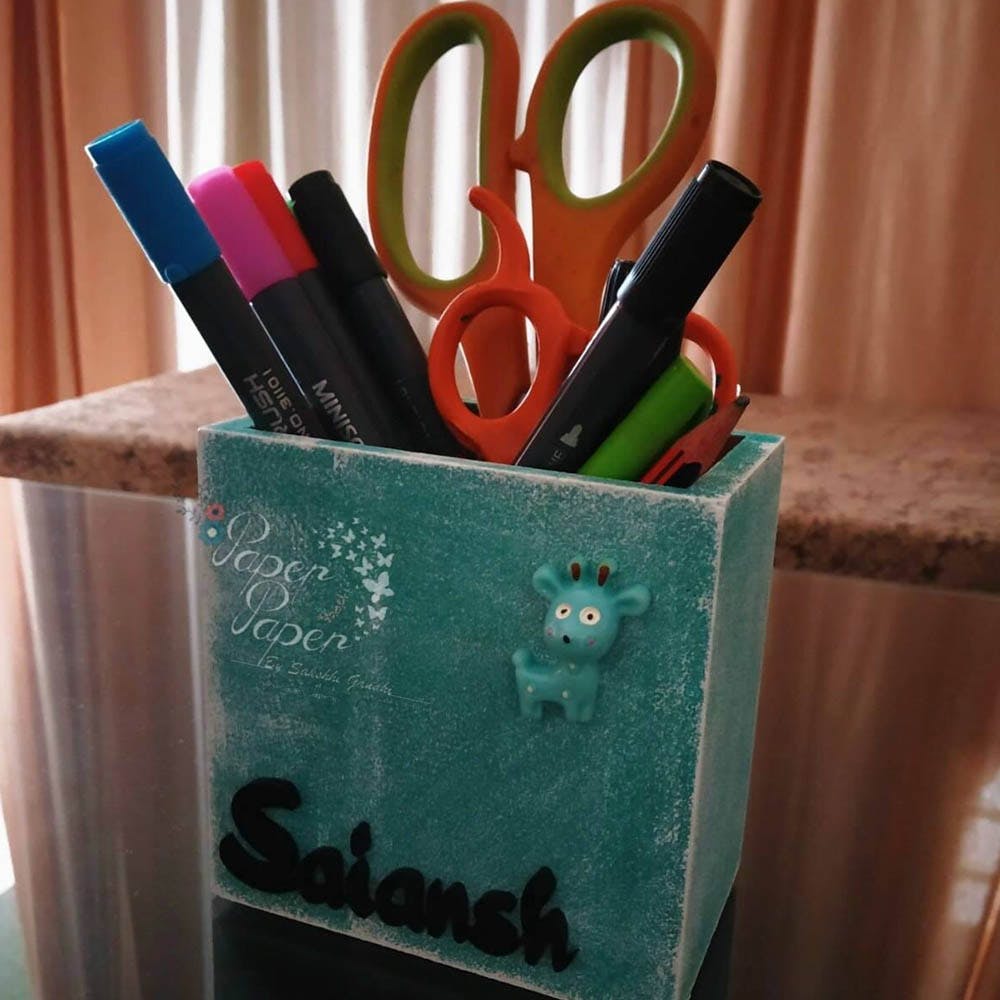 Green,Blue,Turquoise,Pink,Pencil,Office supplies,Writing implement,Material property,Hand,Pencil case