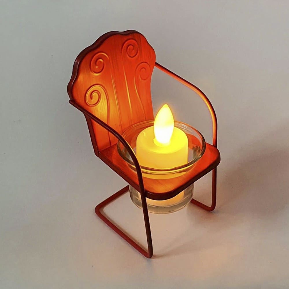 Orange,Lighting,Chair,Light fixture,Lamp,Furniture,Table,Nightlight,Sconce,Still life photography