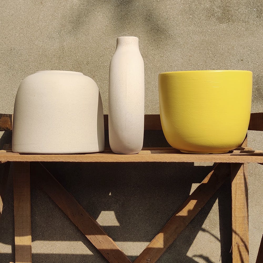 Yellow,Still life photography,Beige,Still life,Cylinder,Room,Table,Ceramic,Serveware,Furniture