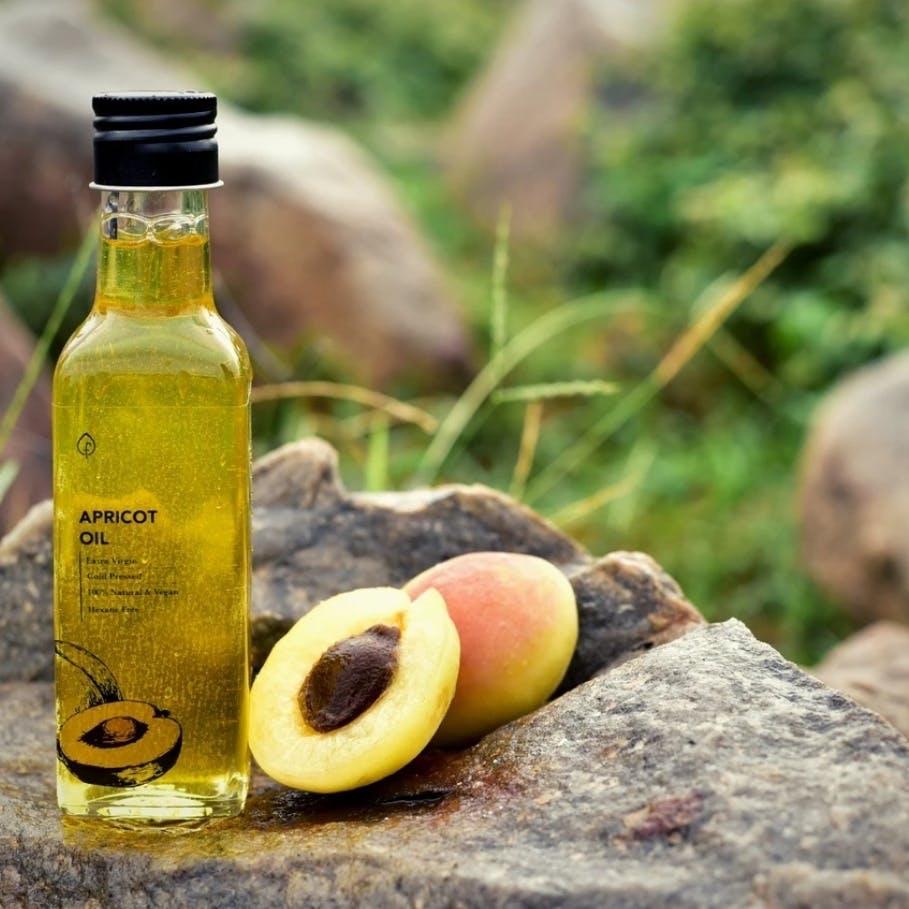 Bottle,Tree,Cooking oil,Plant,Drink,Olive oil,Food,Fruit,Oil,Extra virgin olive oil