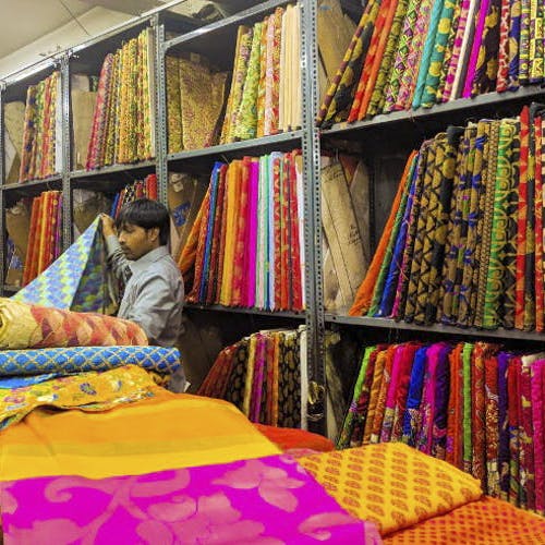 Textile,Room,Furniture,Carpet,Bazaar,Linens,Thread,Woven fabric,Building,Art