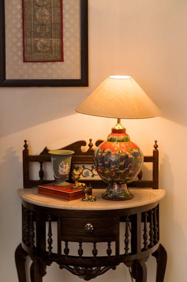 Room,Furniture,Table,Interior design,Lighting accessory,House,Light fixture,End table,Lampshade,Home accessories