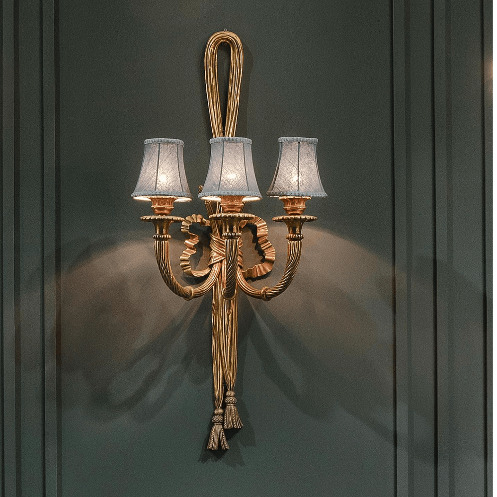 Light fixture,Lighting,Chandelier,Sconce,Bronze,Candle holder,Metal,Brass,Interior design,Lamp