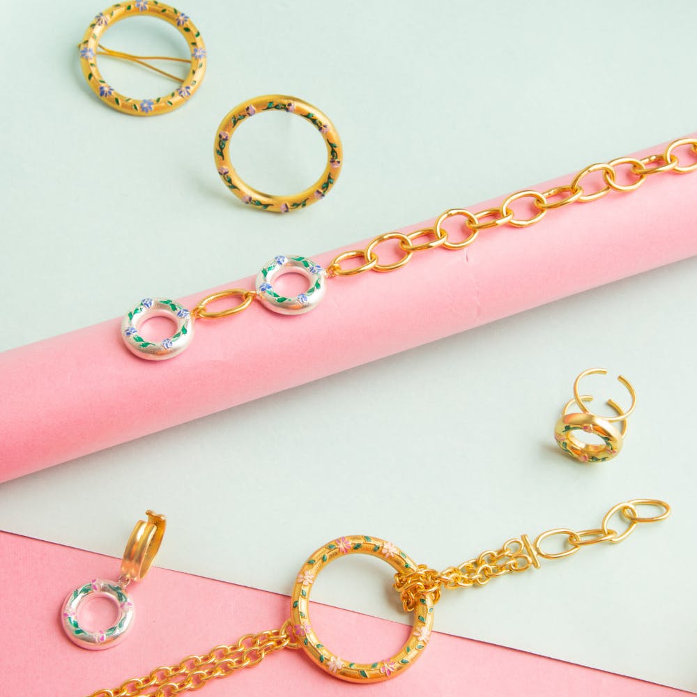 Pink,Body jewelry,Chain,Fashion accessory,Jewellery,Font,Magenta,Metal
