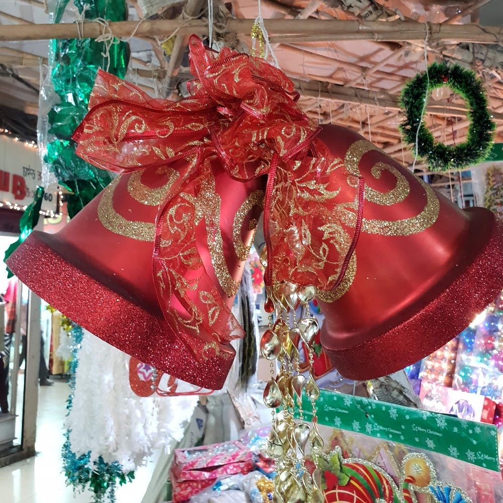 Red,Christmas decoration,Christmas,Christmas ornament,Present,Tradition,Interior design,Ribbon,Ornament,Event