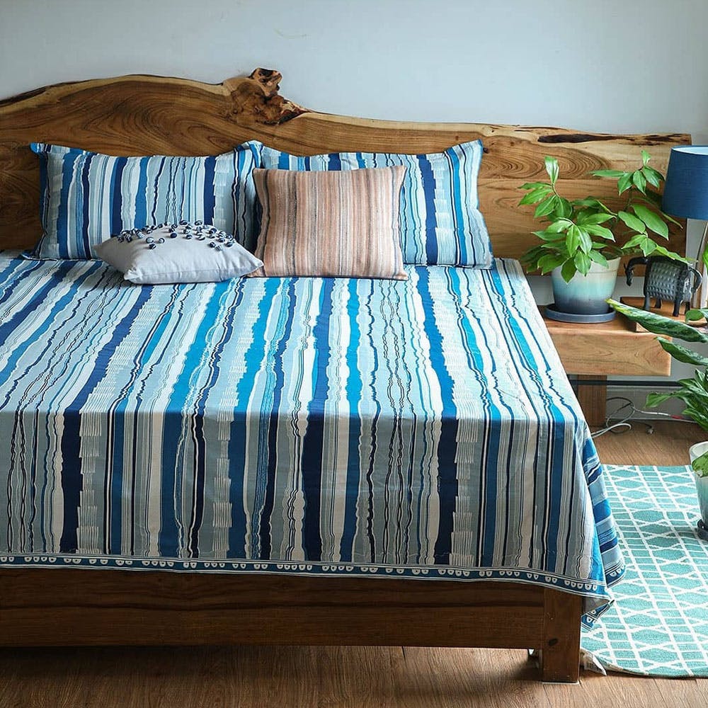 Bedding,Bed sheet,Furniture,Bed,Blue,Bedroom,Turquoise,Textile,Bed frame,Aqua