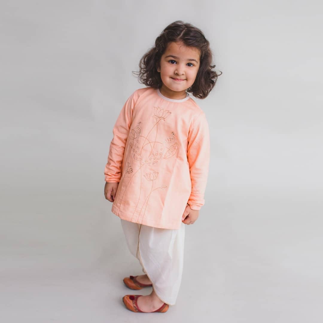 Clothing,White,Pink,Peach,Sleeve,Child,Neck,Child model,Toddler,Outerwear