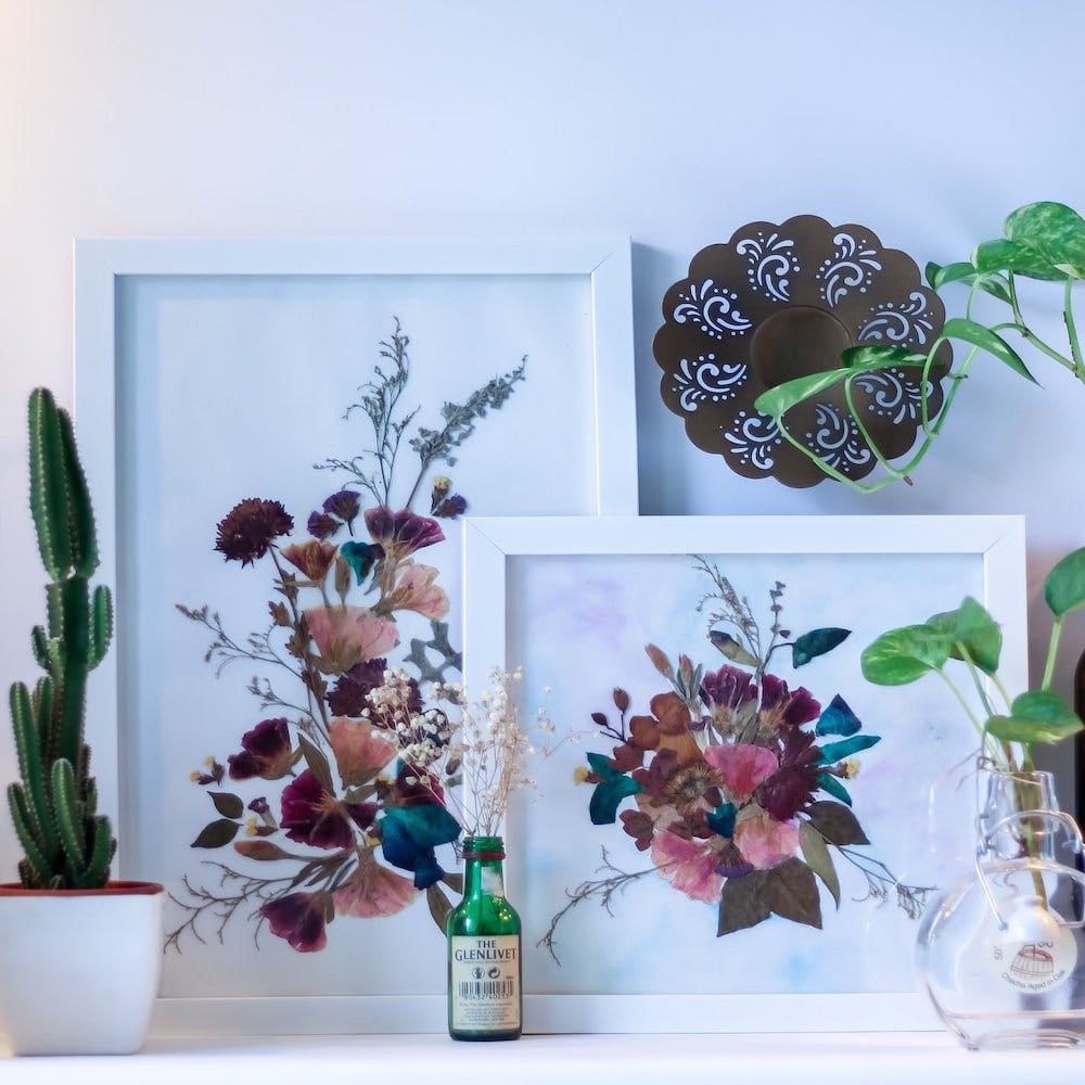 Flowerpot,Flower,Petal,Flowering plant,Botany,Interior design,Still life photography,Bottle,Glass bottle,Vase