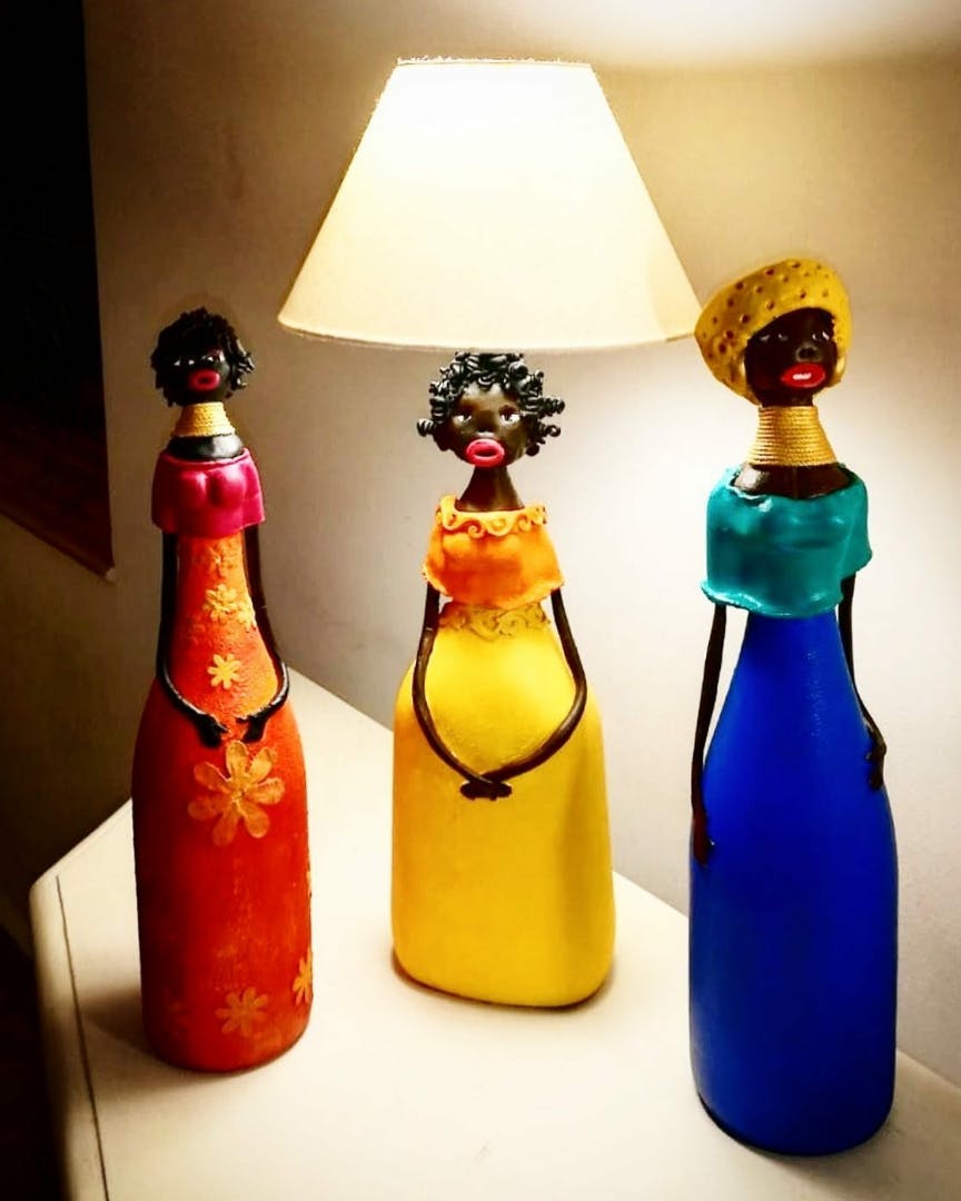Bottle,Cobalt blue,Glass bottle,Lampshade,Yellow,Lighting accessory,Lighting,Light fixture,Wine bottle,Lamp