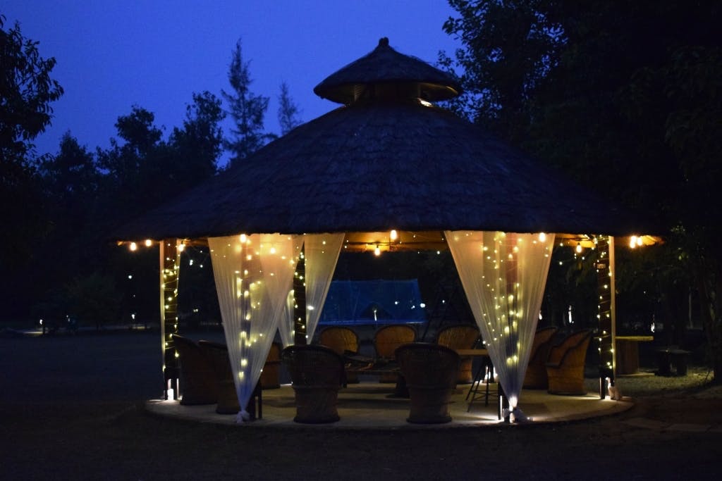 Gazebo,Night,Light,Shade,Tints and shades,Pavilion,Roof,Outdoor structure,Evening,Midnight