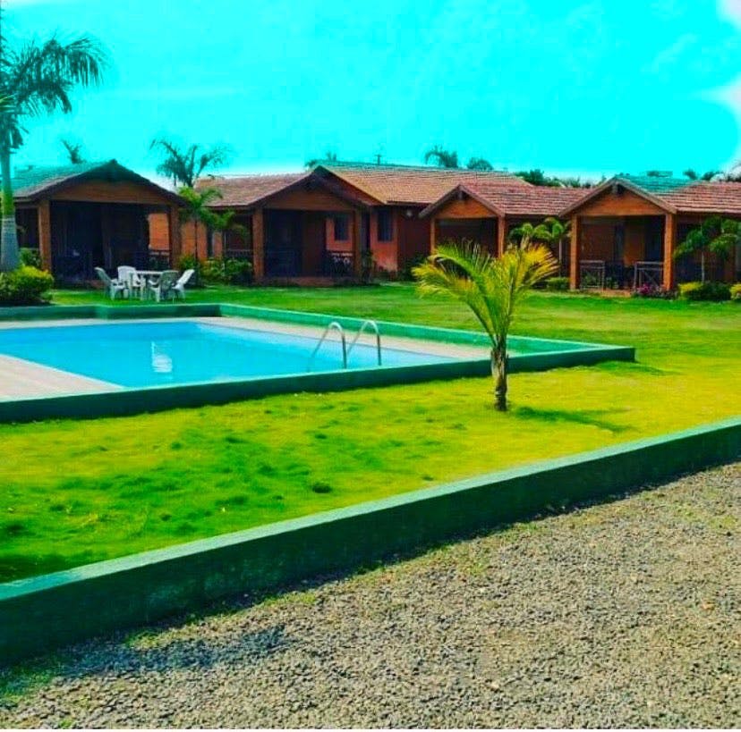 Grass,Property,Swimming pool,House,Real estate,Land lot,Building,Lawn,Home,Resort
