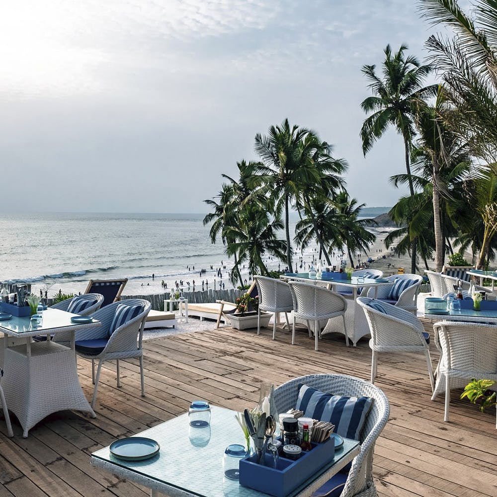 Outdoor furniture,Furniture,Table,Resort,Ocean,Arecales,Azure,Turquoise,Beach,Outdoor table