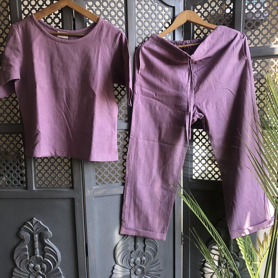 Outerwear,Photograph,White,Purple,Fixture,Black,Textile,Sleeve,One-piece garment,Yellow