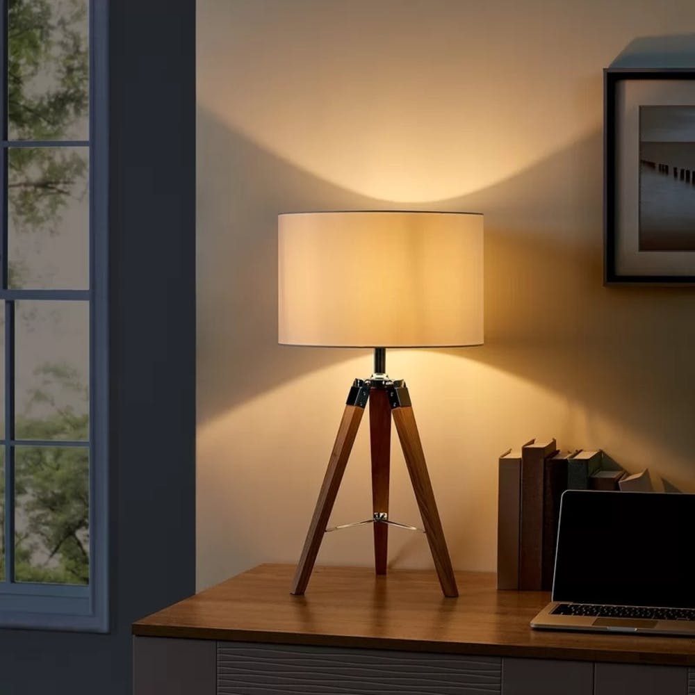 Table,Furniture,Lamp,Wood,Building,Desk,Window,Interior design,Picture frame,Tripod