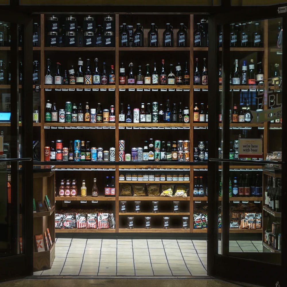 Shelf,Furniture,Bottle,Drinking establishment,Building,Shelving,Barware,Glass bottle,Wine,Publication