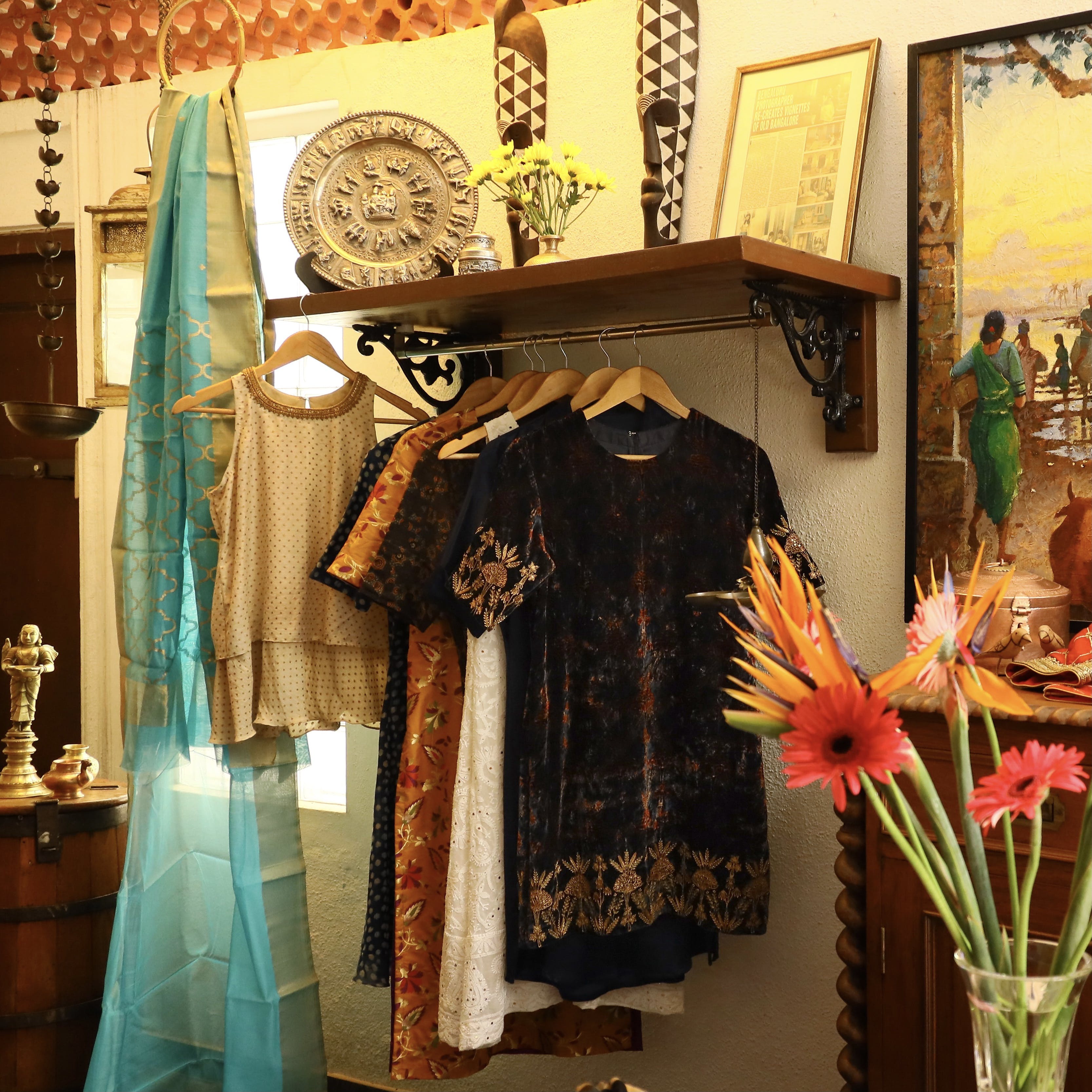 Flower,Picture frame,Interior design,Yellow,Plant,Clothes hanger,Retail,Event,Flower Arranging,Religious item