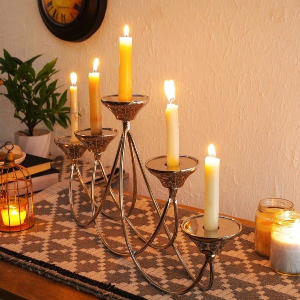 Candle,Property,Light,Wax,Candle holder,Lighting,Amber,Interior design,Decoration,Yellow