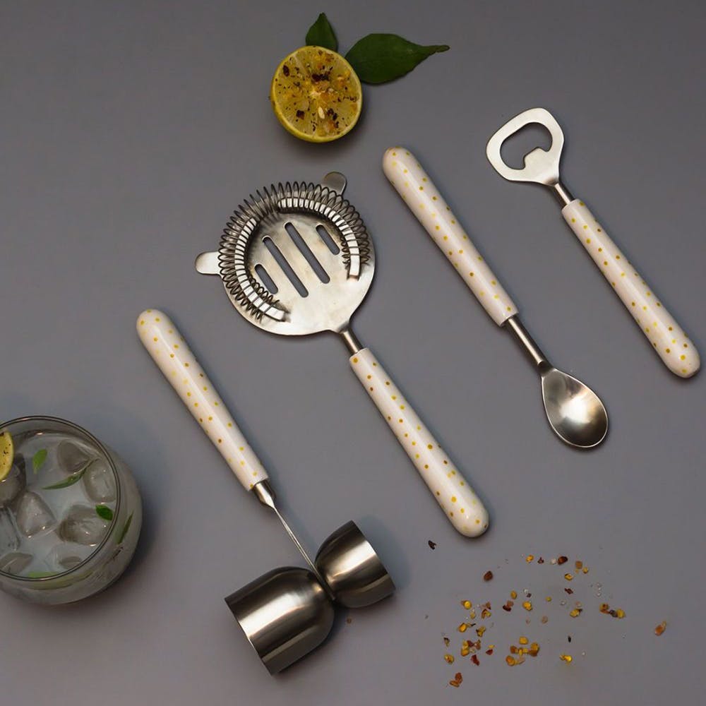 Tableware,Cutlery,Kitchen utensil,Material property,Font,Metal,Circle,Fashion accessory,Nickel,Dishware