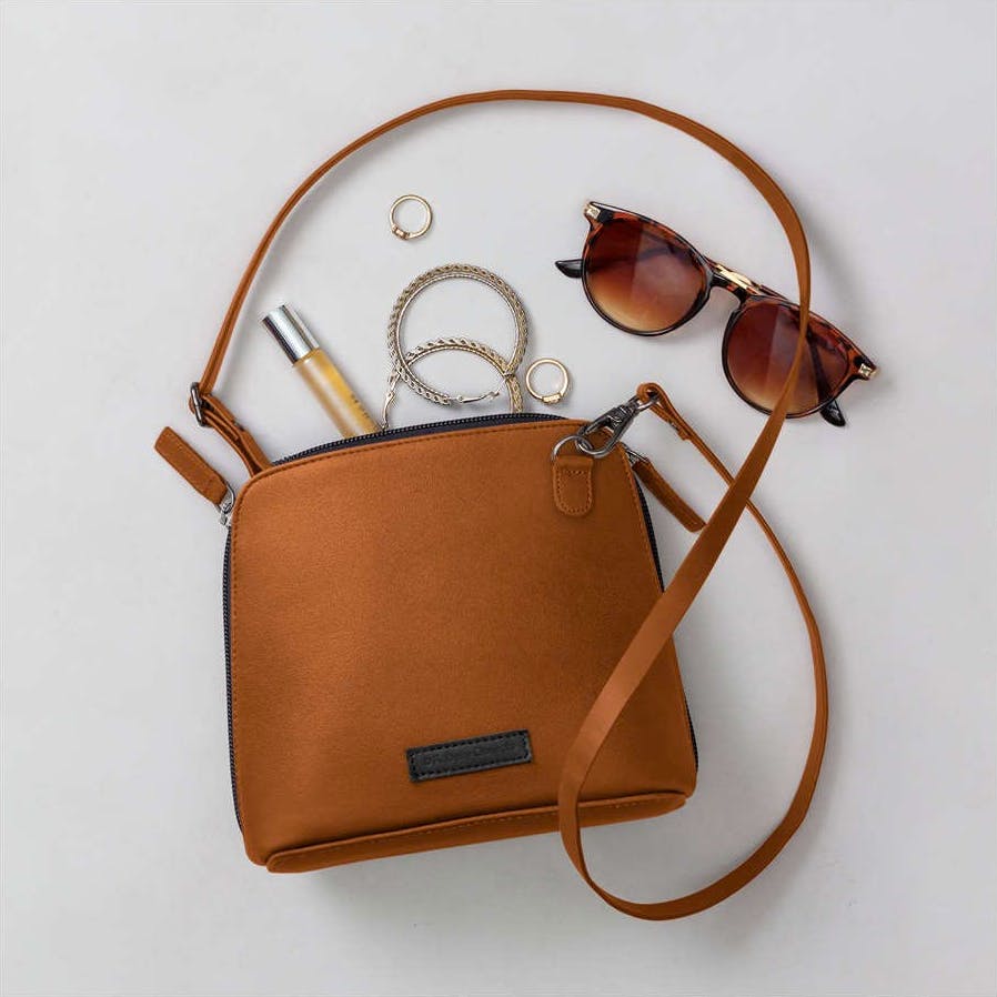 Brown,Luggage and bags,Product,Bag,Vision care,Sunglasses,Eye glass accessory,Amber,Shoulder bag,Material property