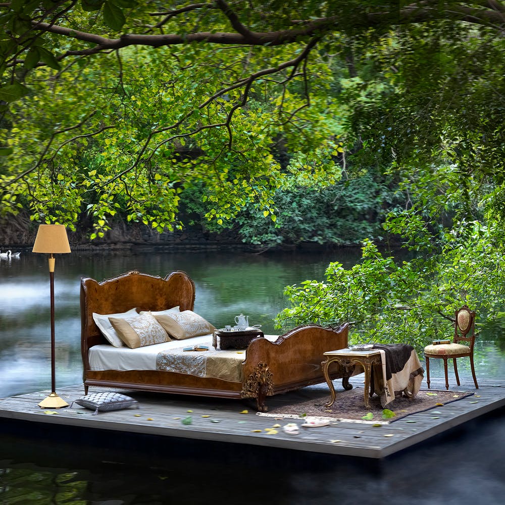 Property,Water,Table,Plant,Tree,Shade,Wood,Outdoor furniture,Natural landscape,Grass