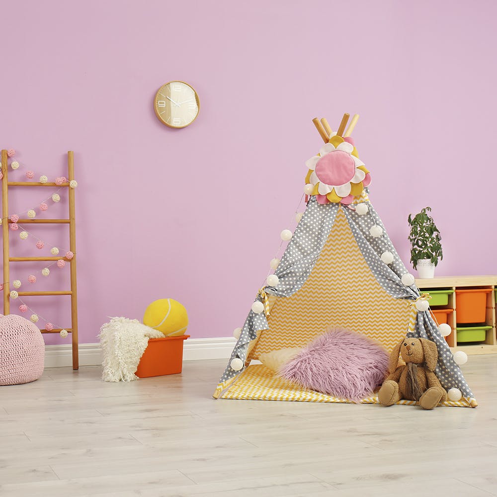 Floor,Wood,Shelf,Toy,Cone,Flooring,Event,Room,Wall sticker,Paper product