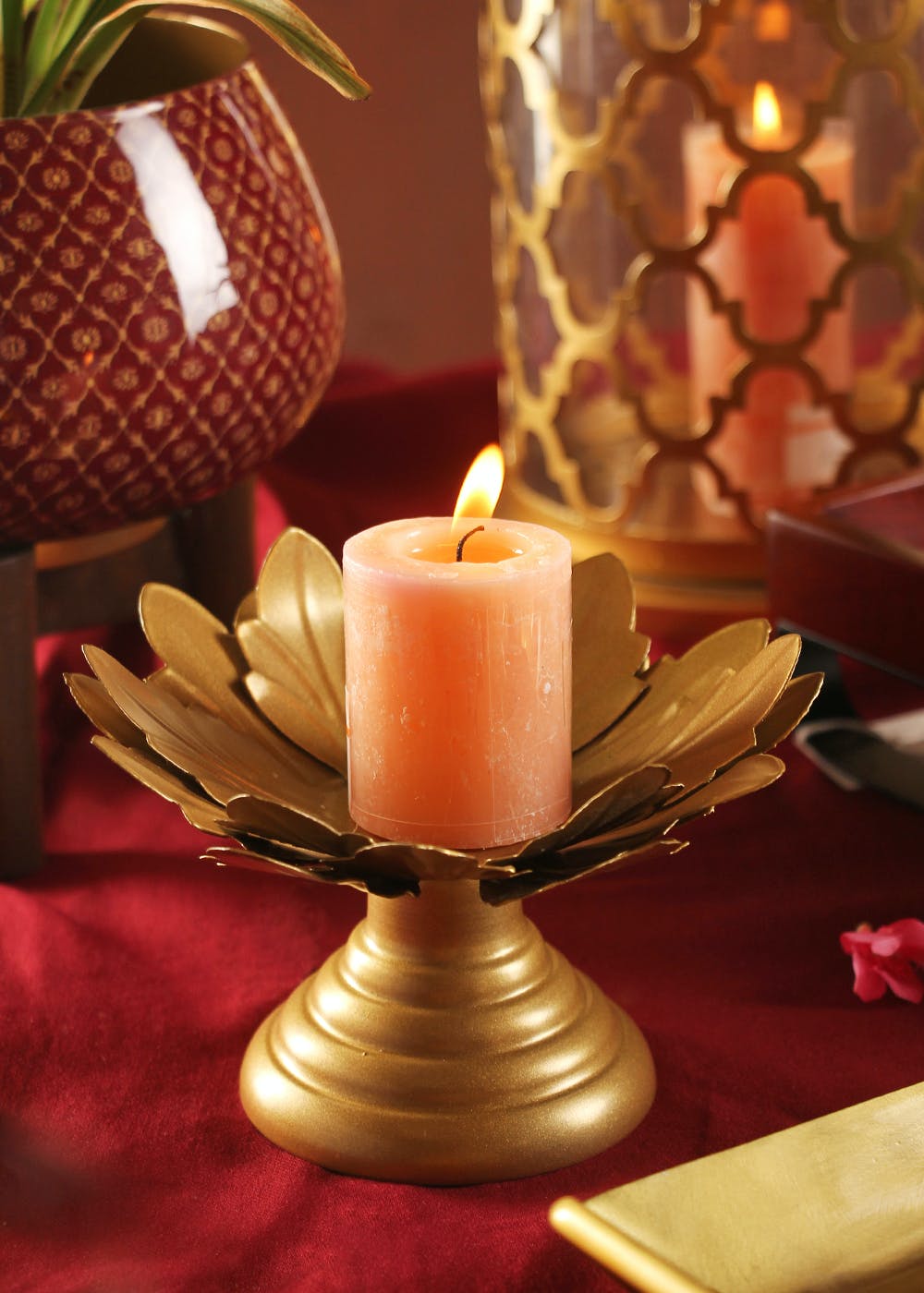 Candle,Light,Wax,Drinkware,Cup,Interior design,Orange,Lighting,Candle holder,Serveware