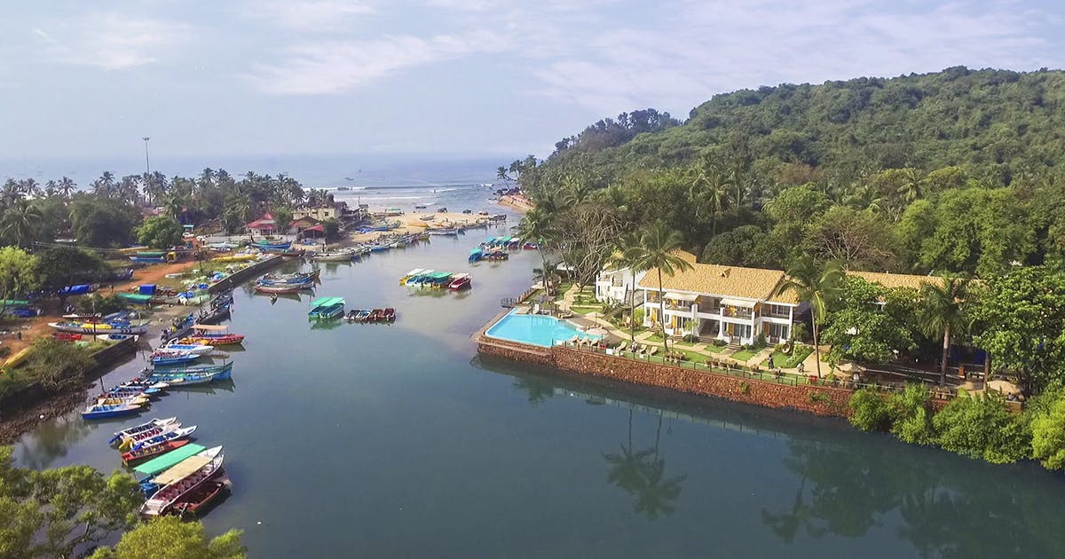 Stay At This Goan Resort By The Baga River | LBB