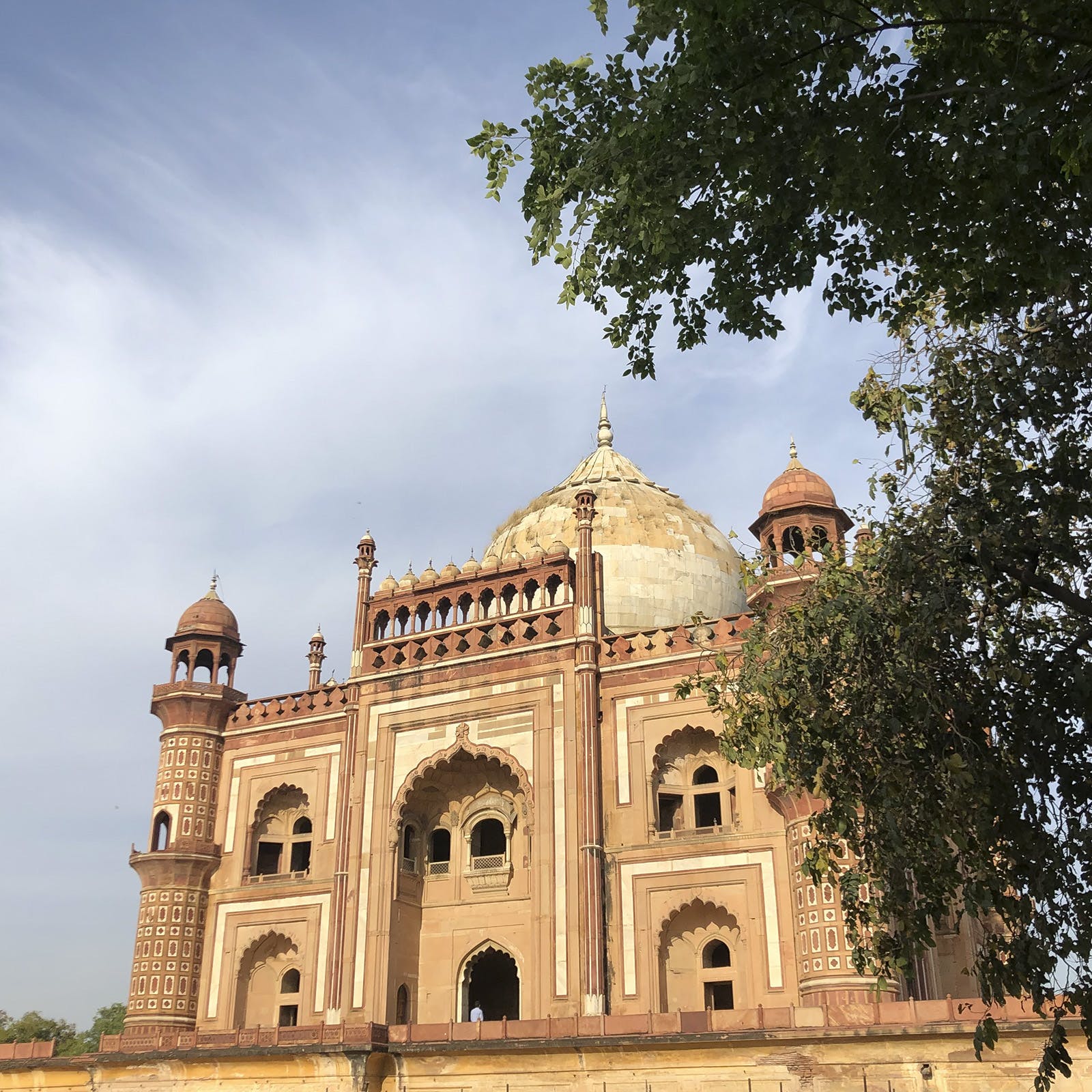 Sky,Cloud,Tree,Monument,Tints and shades,Facade,Symmetry,City,Landscape,Arch