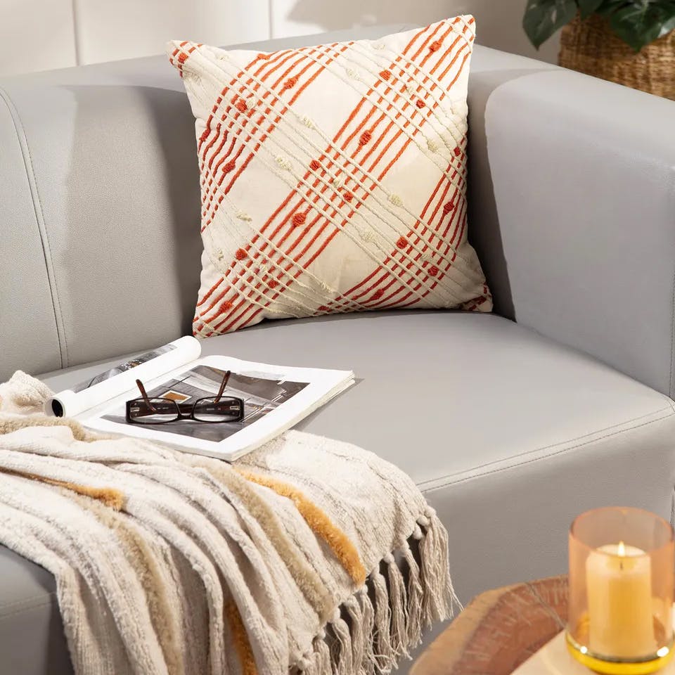 Furniture,Comfort,Textile,Pillow,Rectangle,Orange,Interior design,studio couch,Floor,Wood