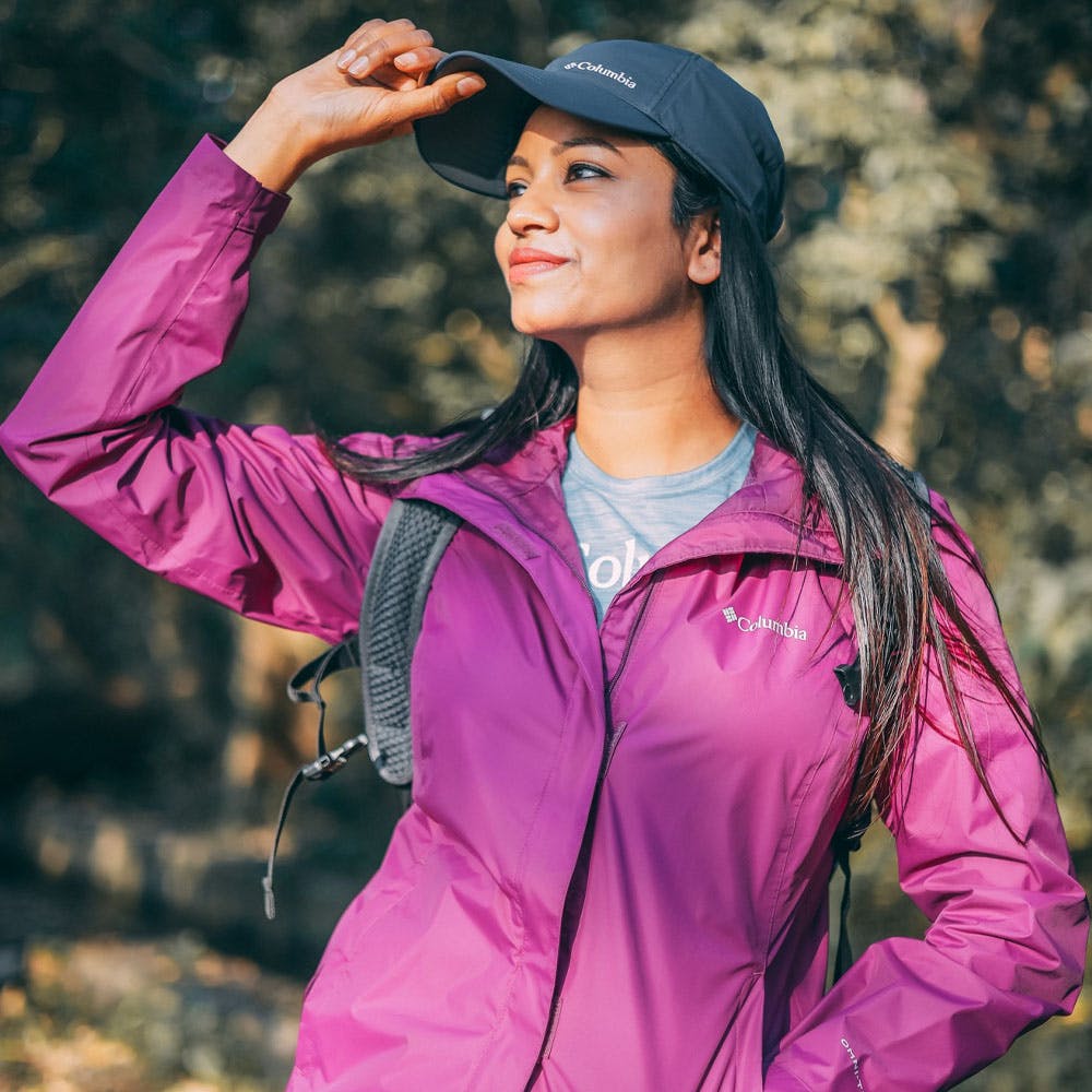 Outerwear,Purple,Fashion,People in nature,Flash photography,Sleeve,Cap,Happy,Gesture,Pink