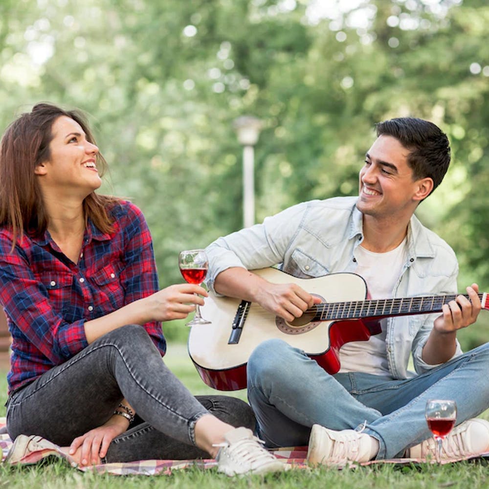 Clothing,Jeans,Smile,Musical instrument,Leg,Guitar,People in nature,Guitar accessory,Happy,Sharing