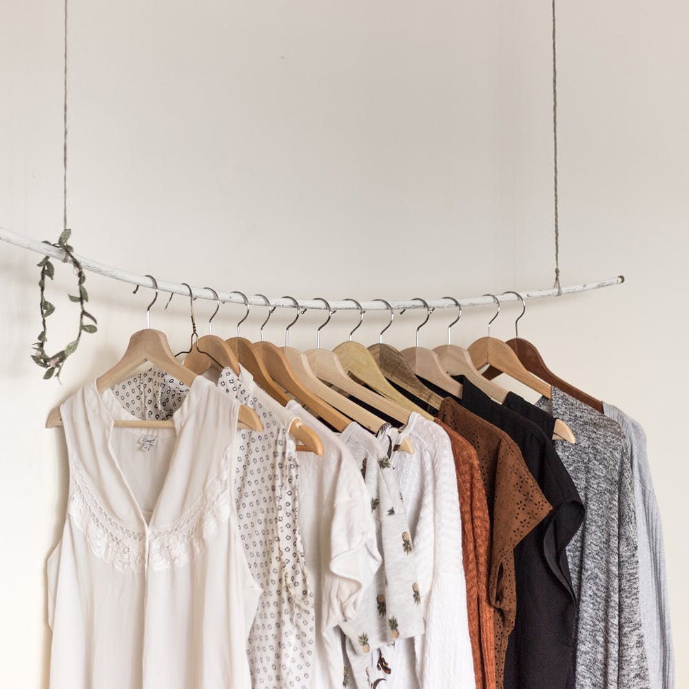 Outerwear,Clothes hanger,Neck,Sleeve,Fashion design,Sleeveless shirt,Font,T-shirt,Pattern,One-piece garment