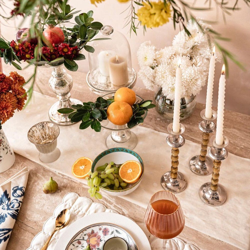 Tableware,Food,Decoration,Dishware,Drinkware,Tablecloth,Table,Stemware,Orange,Flower