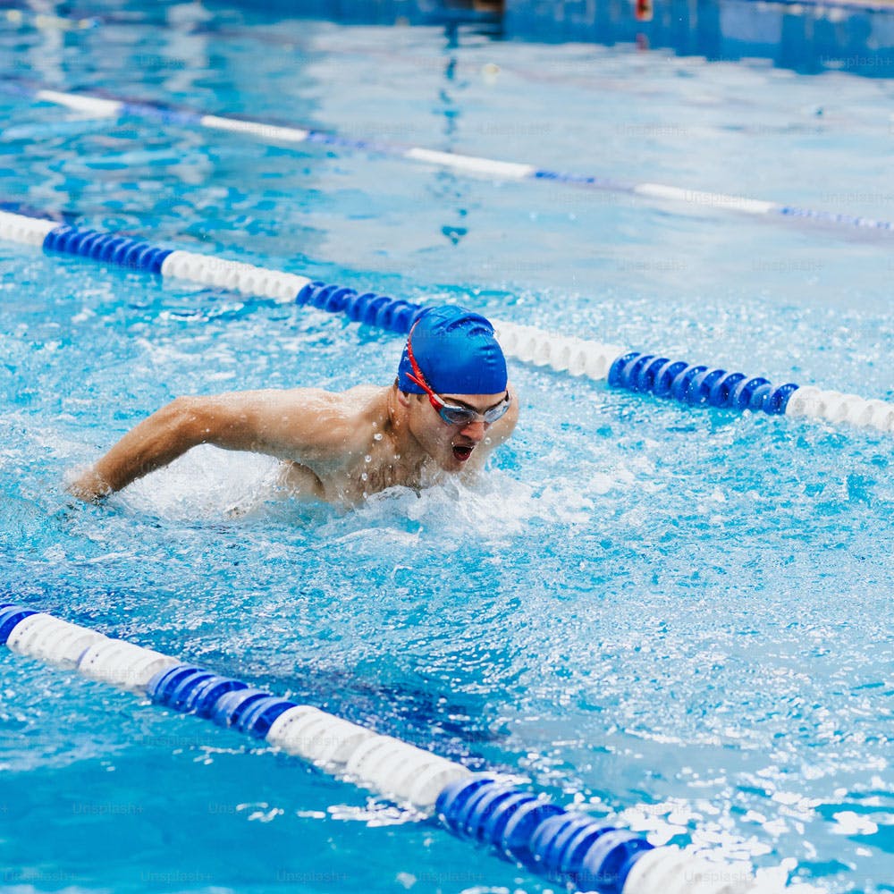 Water,Swimming pool,Cap,Leisure,Swimmer,Fun,Sports,Competition event,Recreation,Athlete