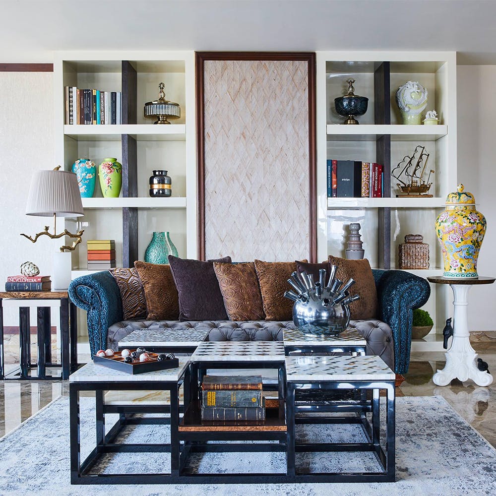 Furniture,Couch,Picture frame,Table,Black,Shelf,Wood,Interior design,Living room,Shelving