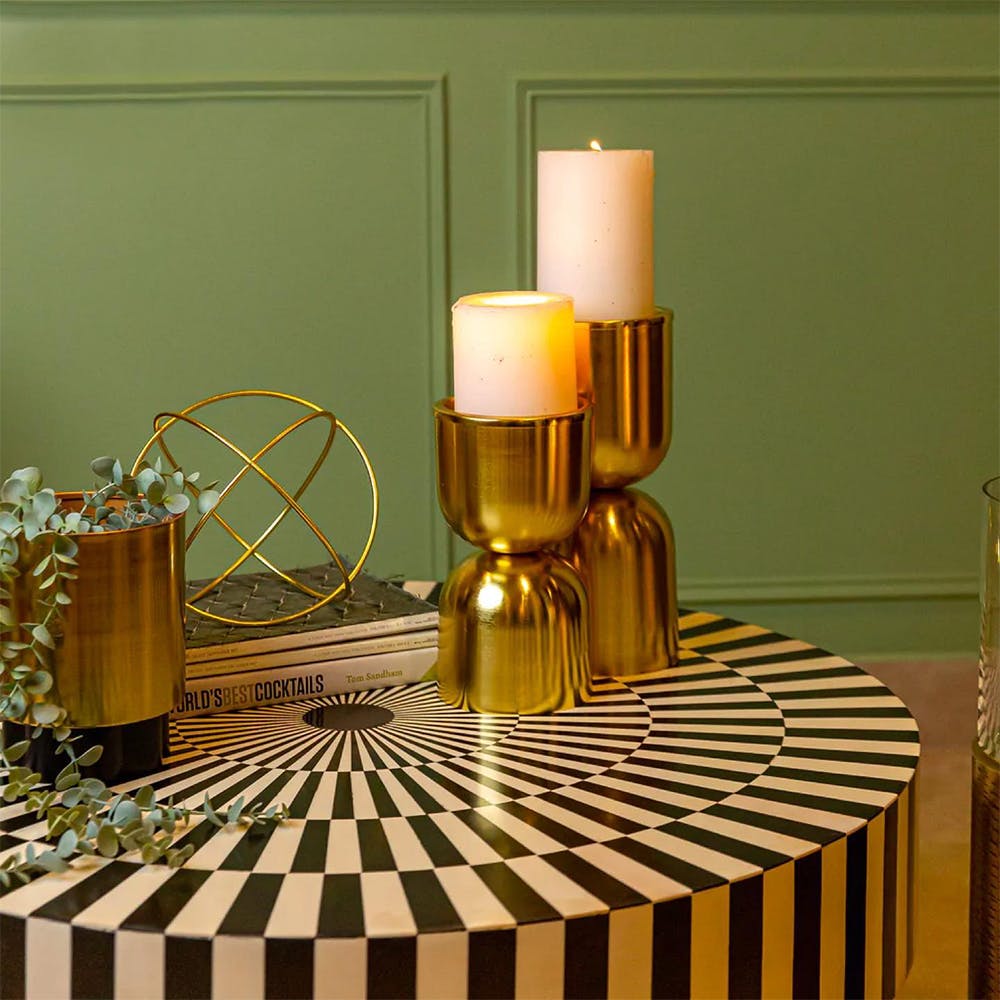 Table,Drinkware,Light,Textile,Wood,Candle holder,Interior design,Liquid,Tableware,Gold