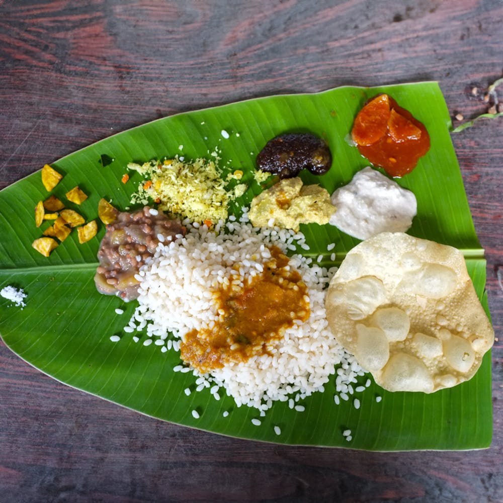 Food,Banana leaf rice,Tableware,Banana leaf,Sadya,Ingredient,Recipe,Rice,Staple food,Dish