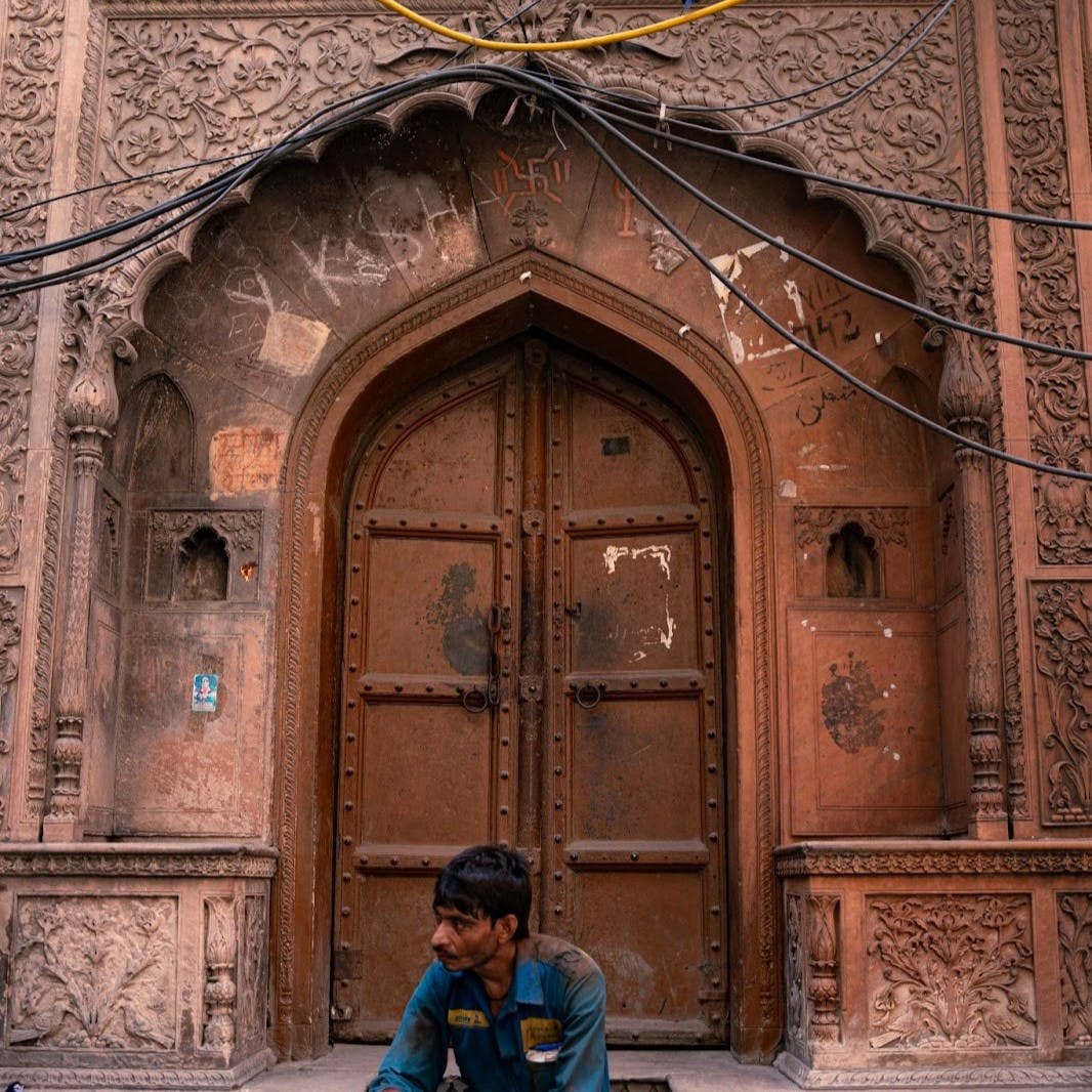 Blue,Temple,Wood,Door,Facade,Brickwork,Symmetry,Brick,Tints and shades,Urban area