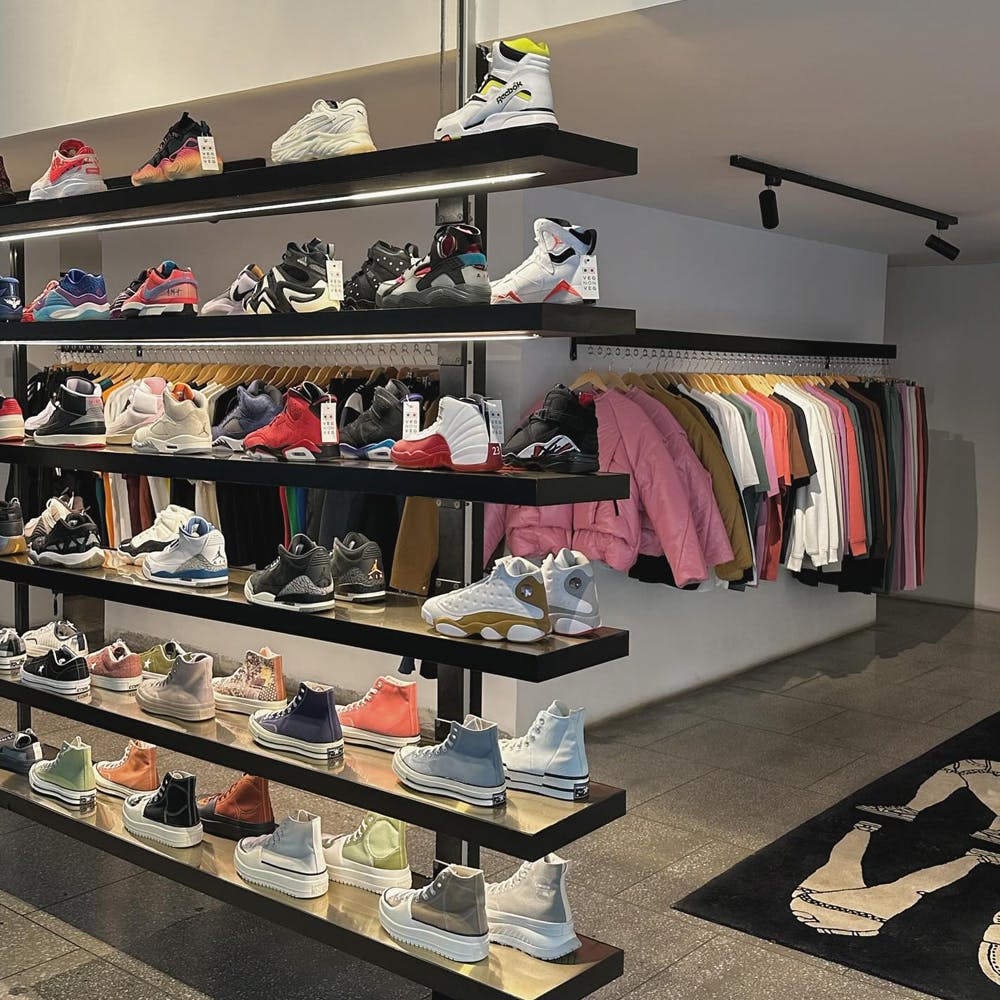 Shoe,Shelf,Shelving,Fashion,Interior design,Automotive design,Floor,Retail,Clothes hanger,Sportswear