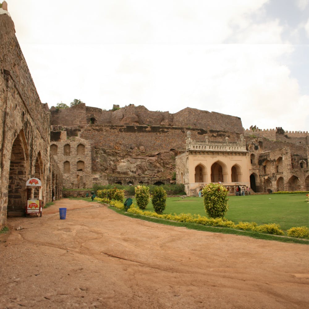 Plant,Sky,Cloud,Landscape,Tree,Facade,Building,Grass,Arch,Archaeological site