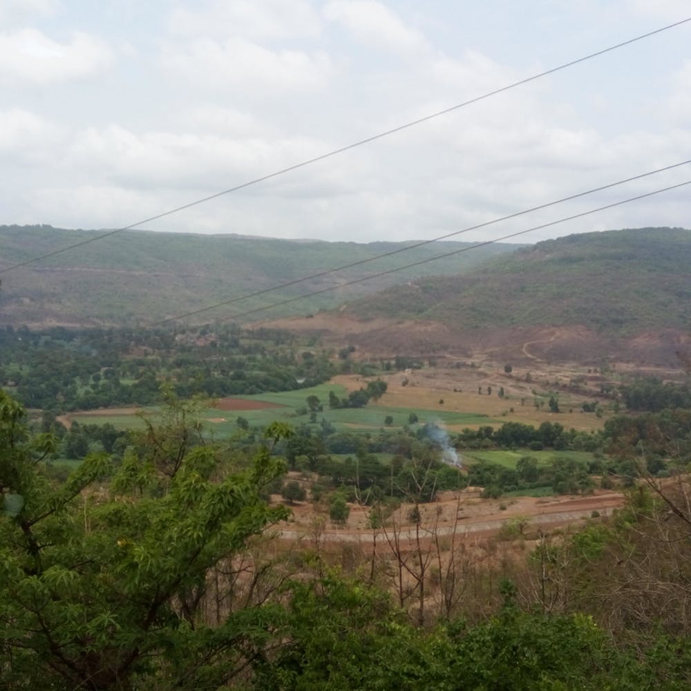 Sky,Cloud,Plant,Plant community,Ecoregion,Land lot,Natural landscape,Highland,Overhead power line,Tree