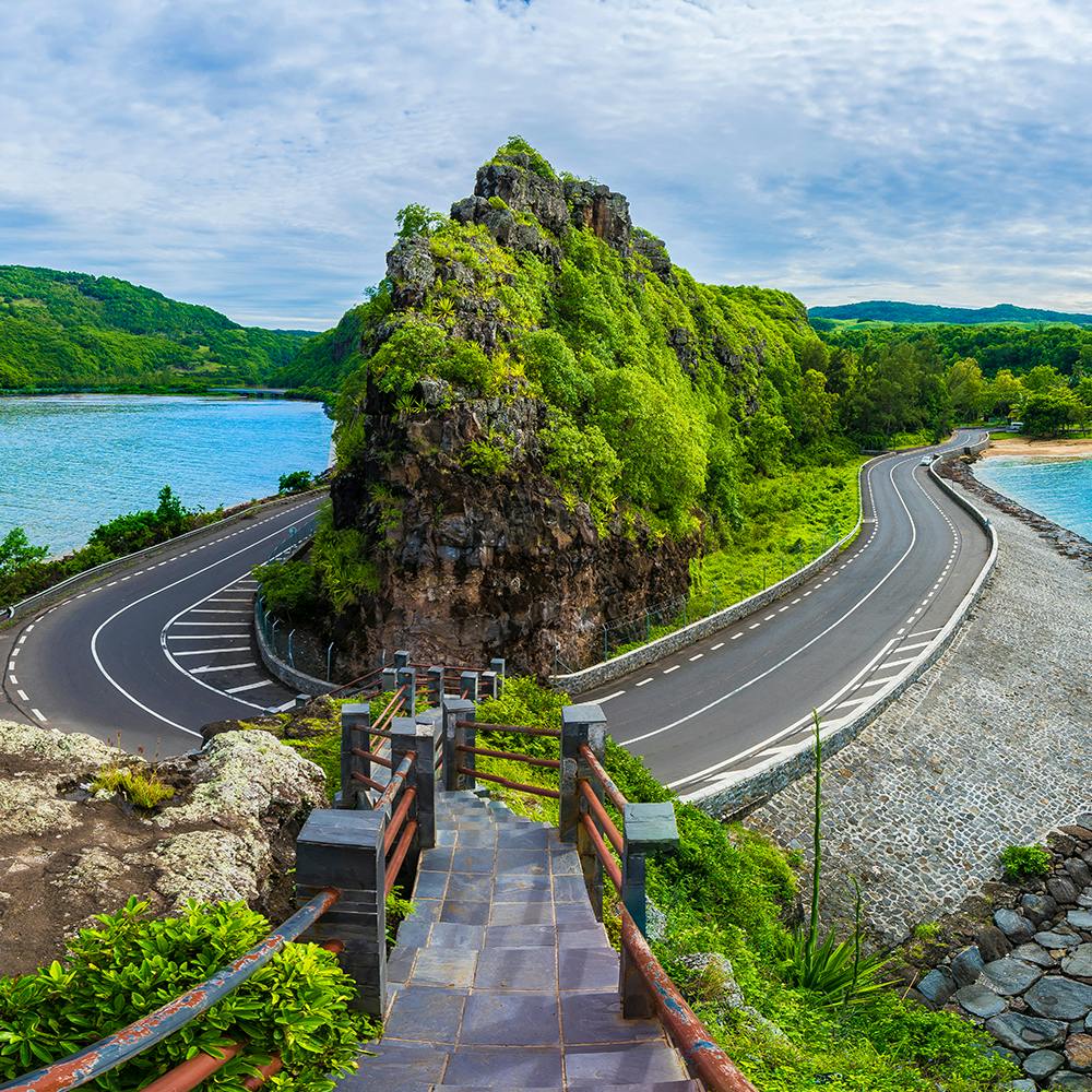 Cloud,Sky,Water,Plant,Infrastructure,Mountain,Road surface,Natural landscape,Highland,Vegetation