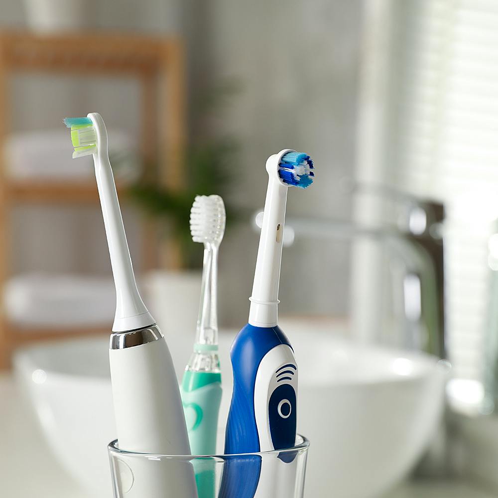 Toothbrush,Brush,Toothbrush holder,Liquid,Medical equipment,Personal care,Eyelash,Audio equipment,Household supply,Electric blue