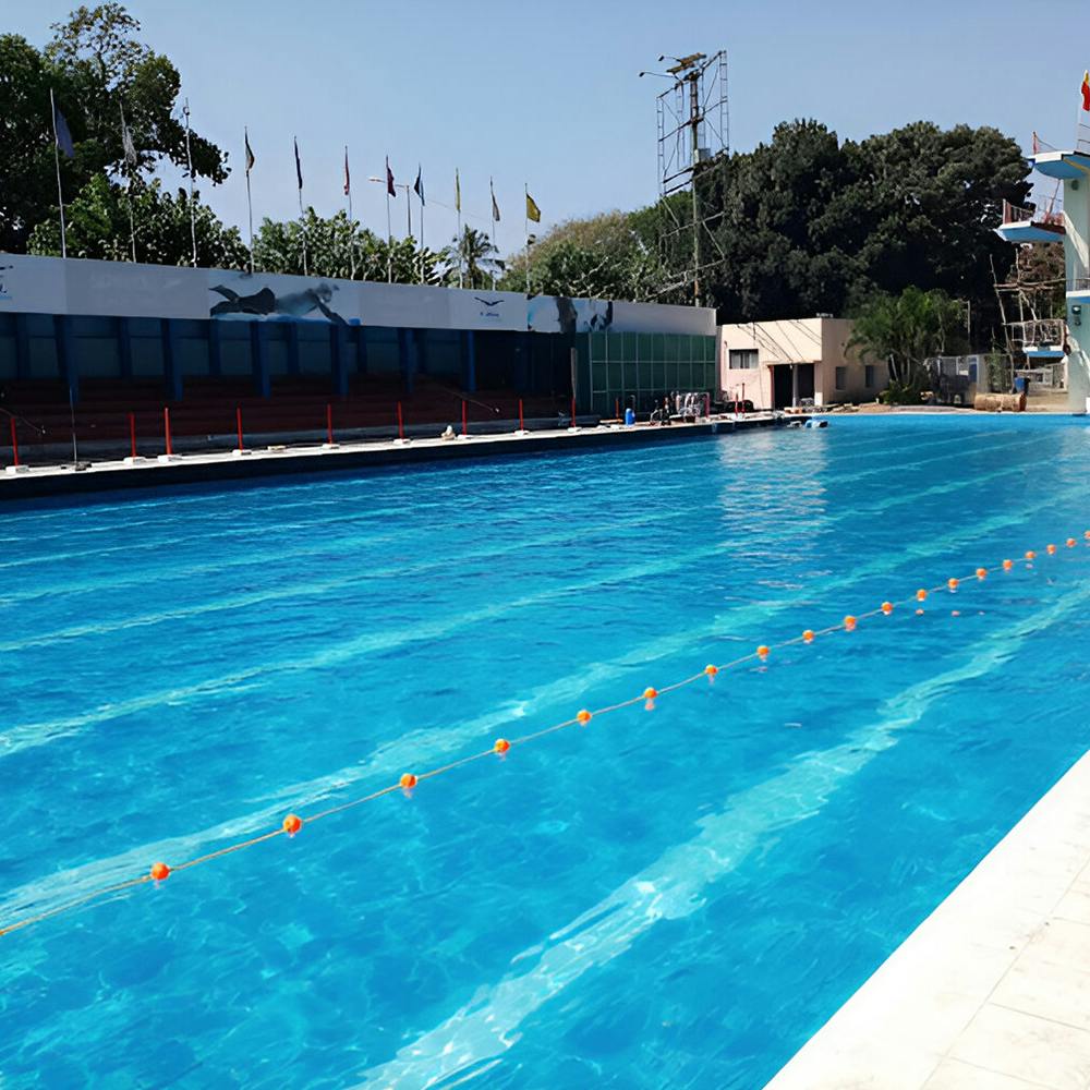 Water,Sky,Swimming pool,Building,Line,Leisure,Tree,Composite material,Sports,Recreation