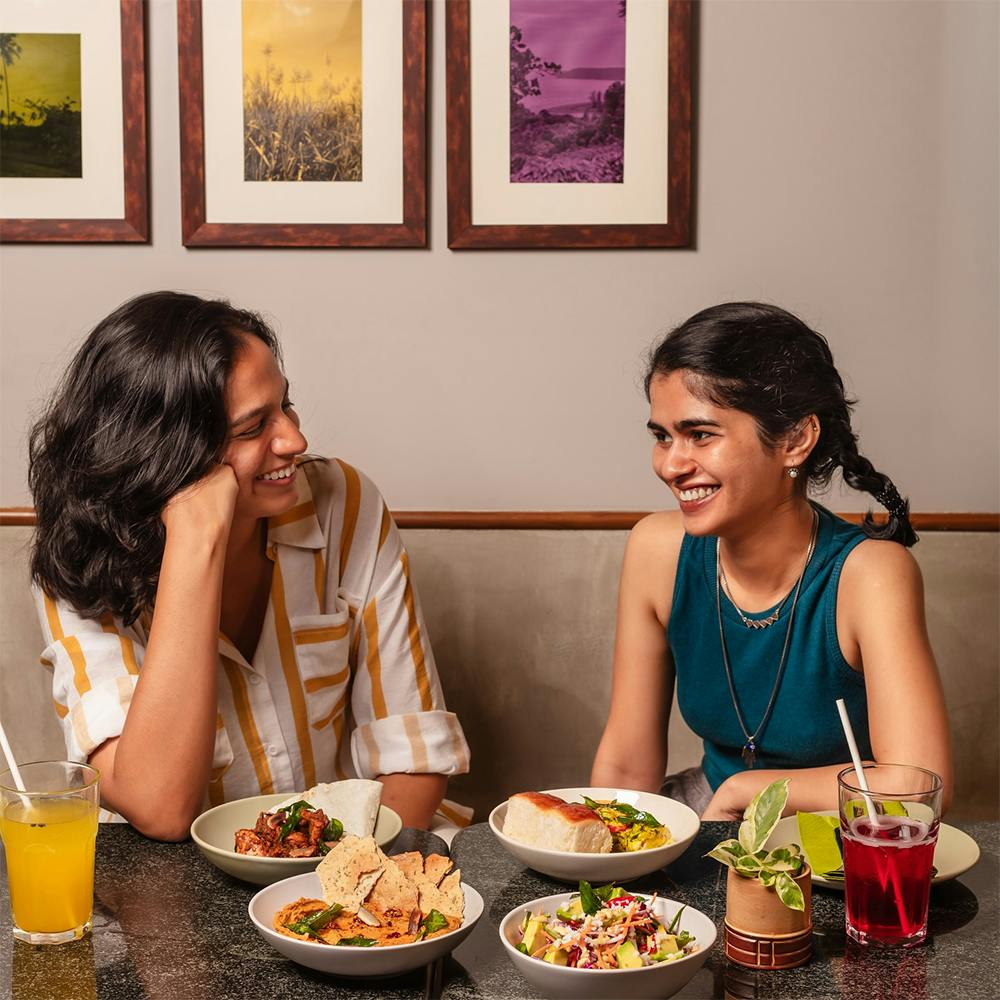 Food,Tableware,Picture frame,Table,Smile,Plate,Yellow,Orange,Sharing,Food craving