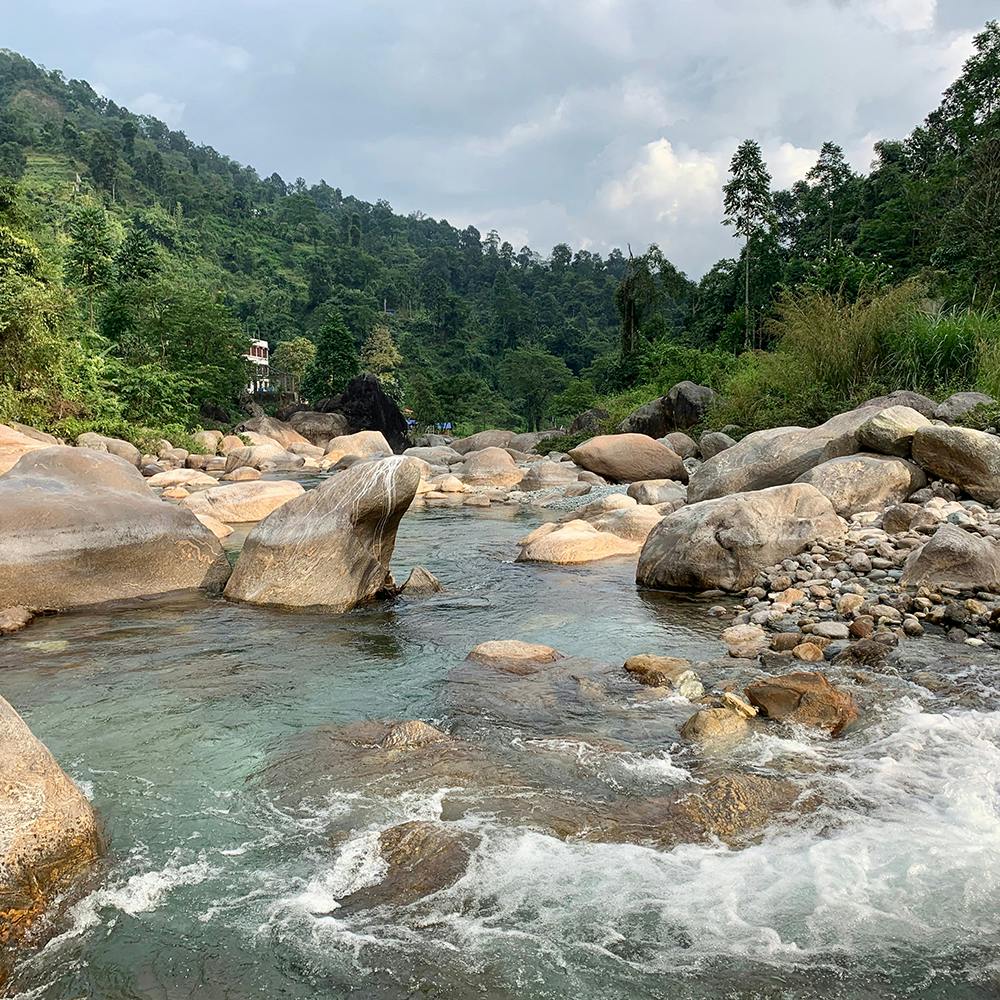 Water,Sky,Cloud,Plant,Fluvial landforms of streams,Natural landscape,Tree,Bedrock,Mountain,Watercourse